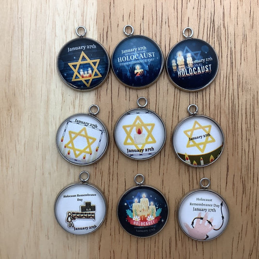 Group of 9 holocaust charms