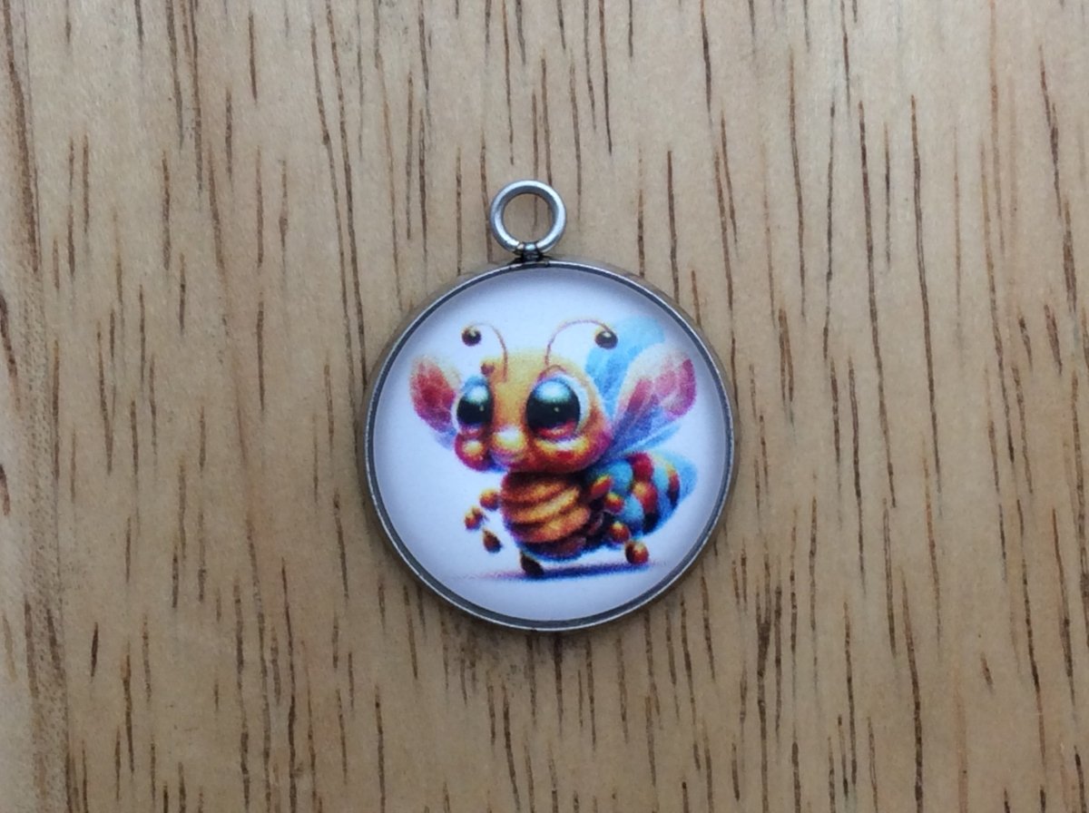 glass cabochon charm with a cute bumble bee image