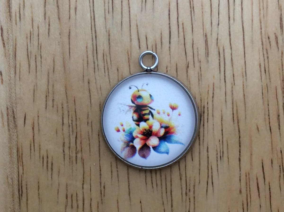 glass cabochon charm with a cute bumble bee image