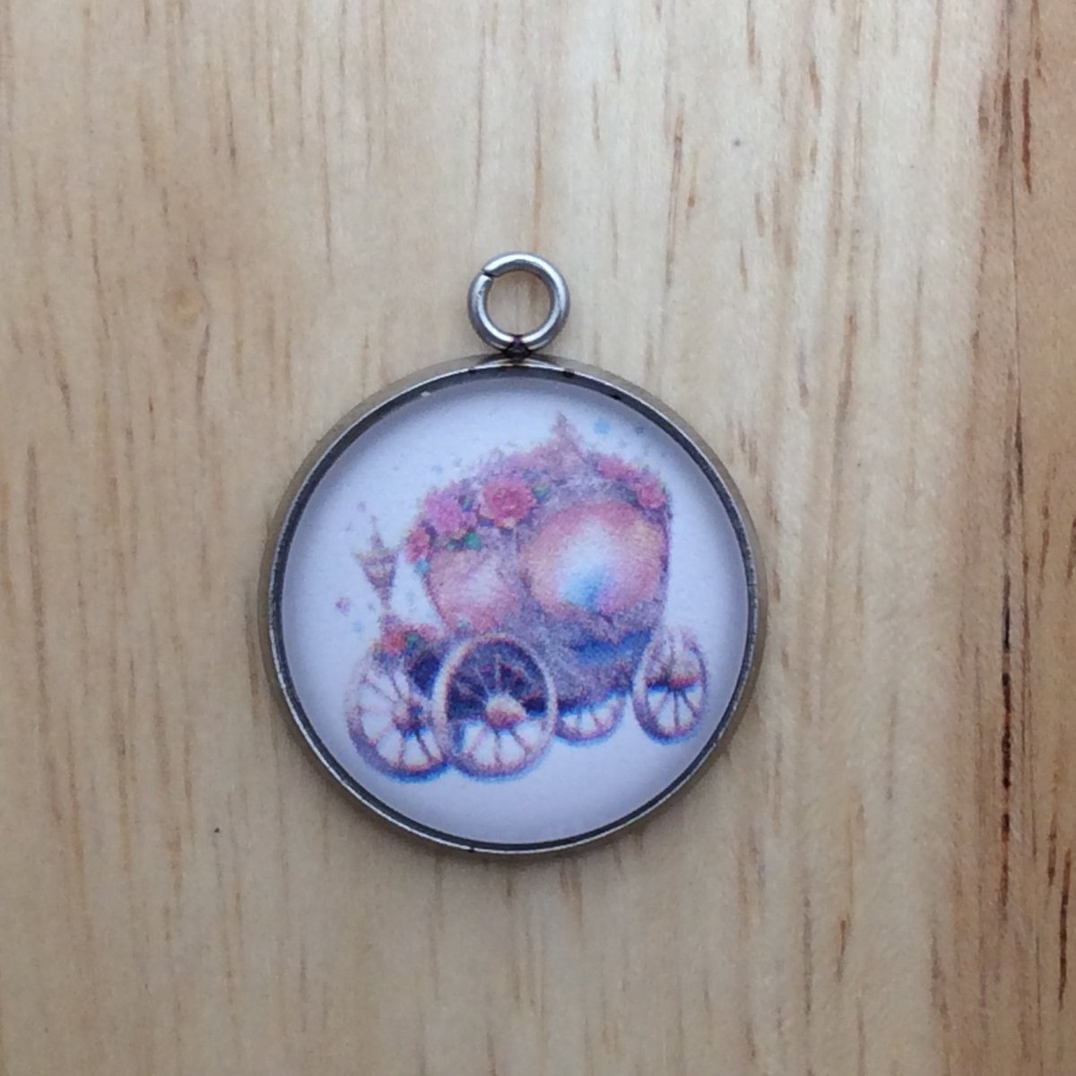 glass cabochon charm with a colorful fairytale chariot