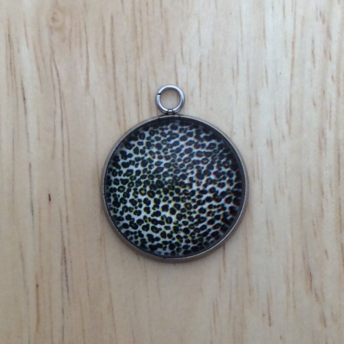 glass cabochon charm with yellow, green and Purple leopard print