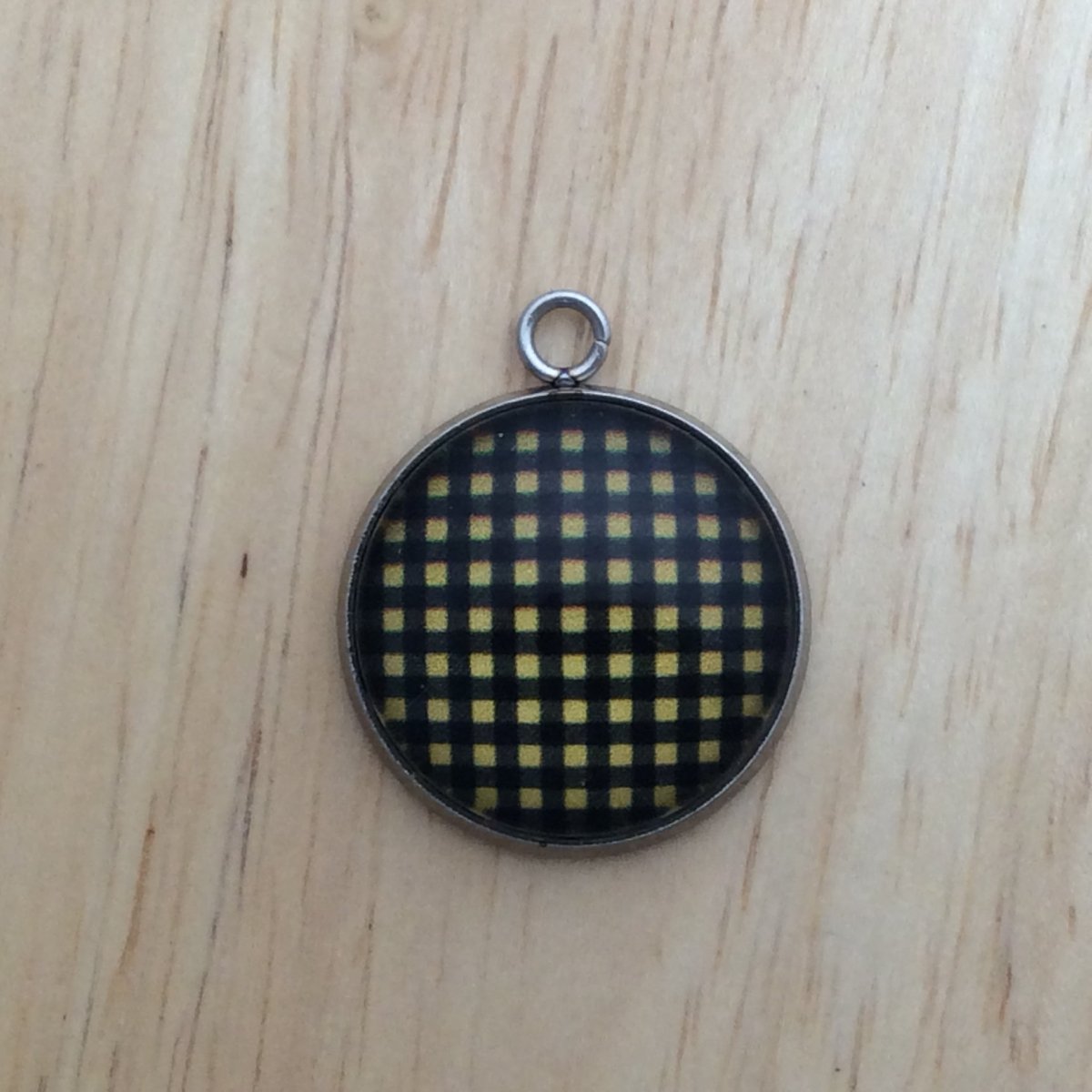 glass cabochon charm with yellow and black plaid print