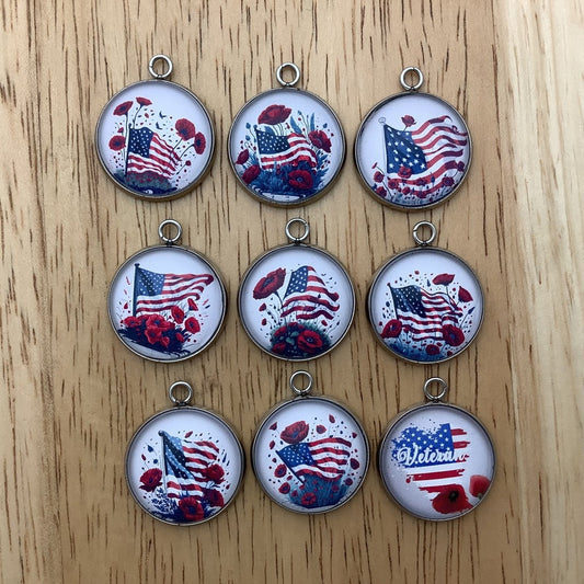 Group of 9 charms featuring a United States Flag and poppies 