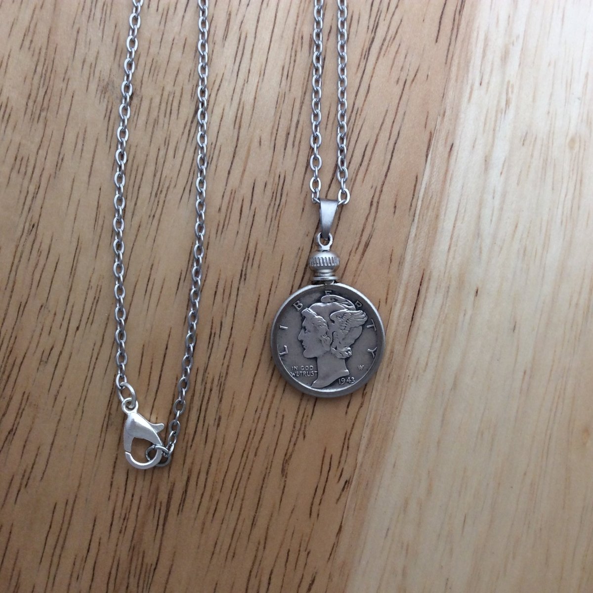 stainless steel necklace with a 1943 Mercury Dime pendant