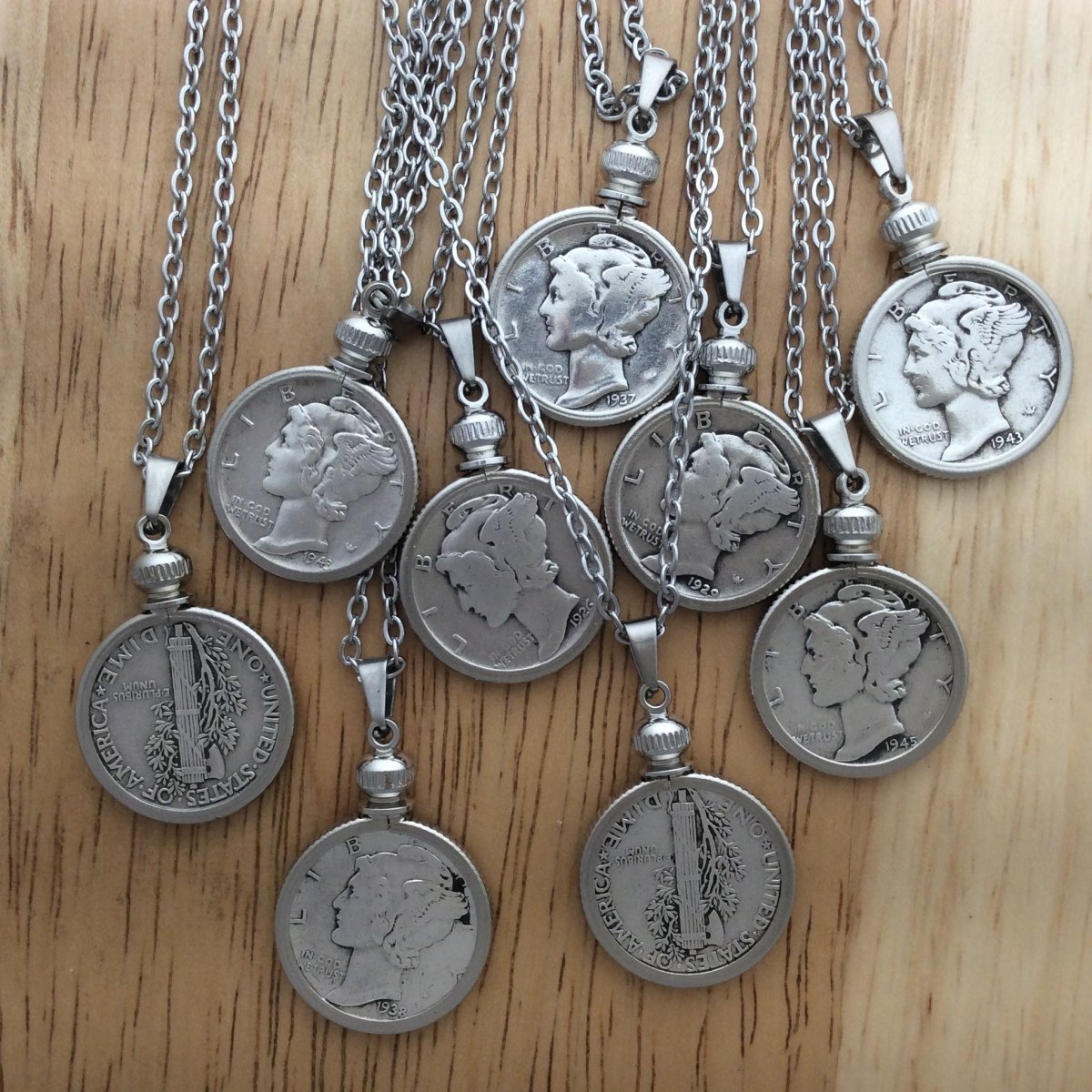 9 stainless steel necklaces with Mercury Dime pendants