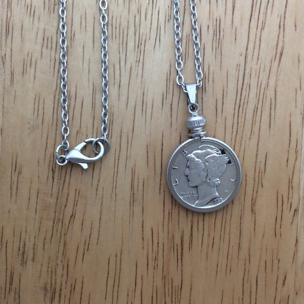 stainless steel necklace with a 1938 Mercury Dime pendant