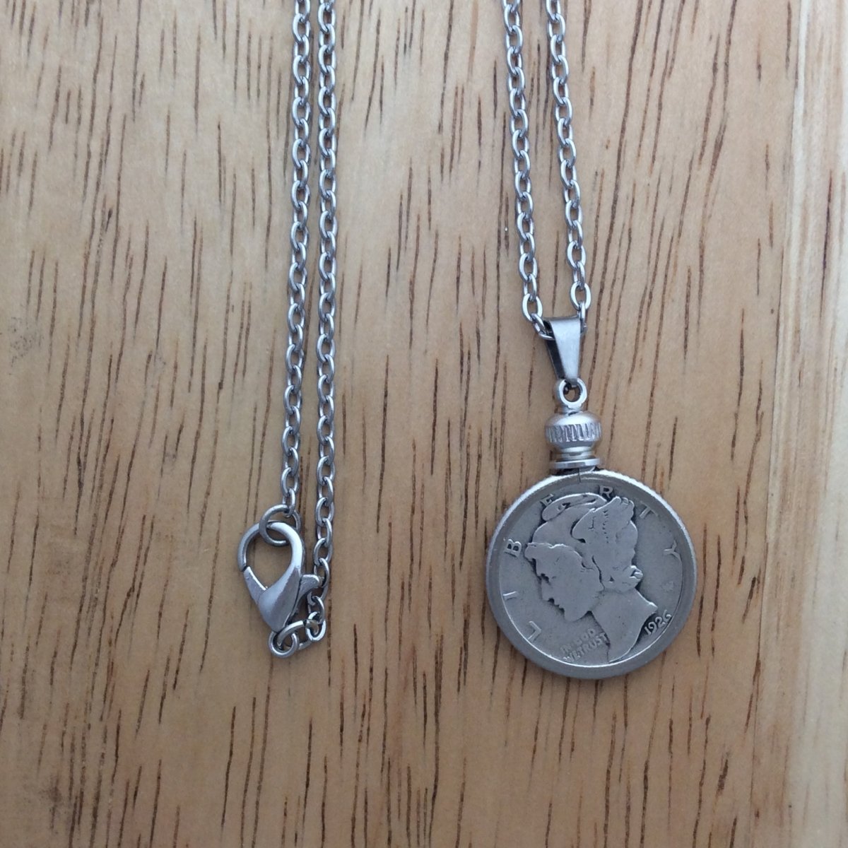 stainless steel necklace with a 1926 Mercury Dime pendant