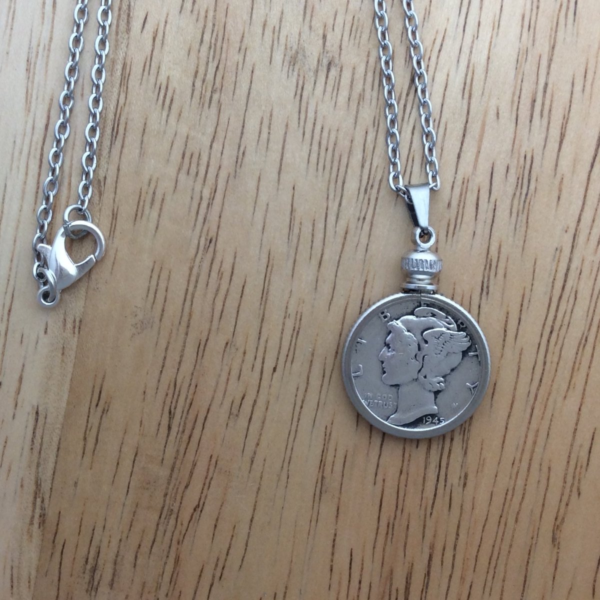 stainless steel necklace with a 1945 Mercury Dime pendant