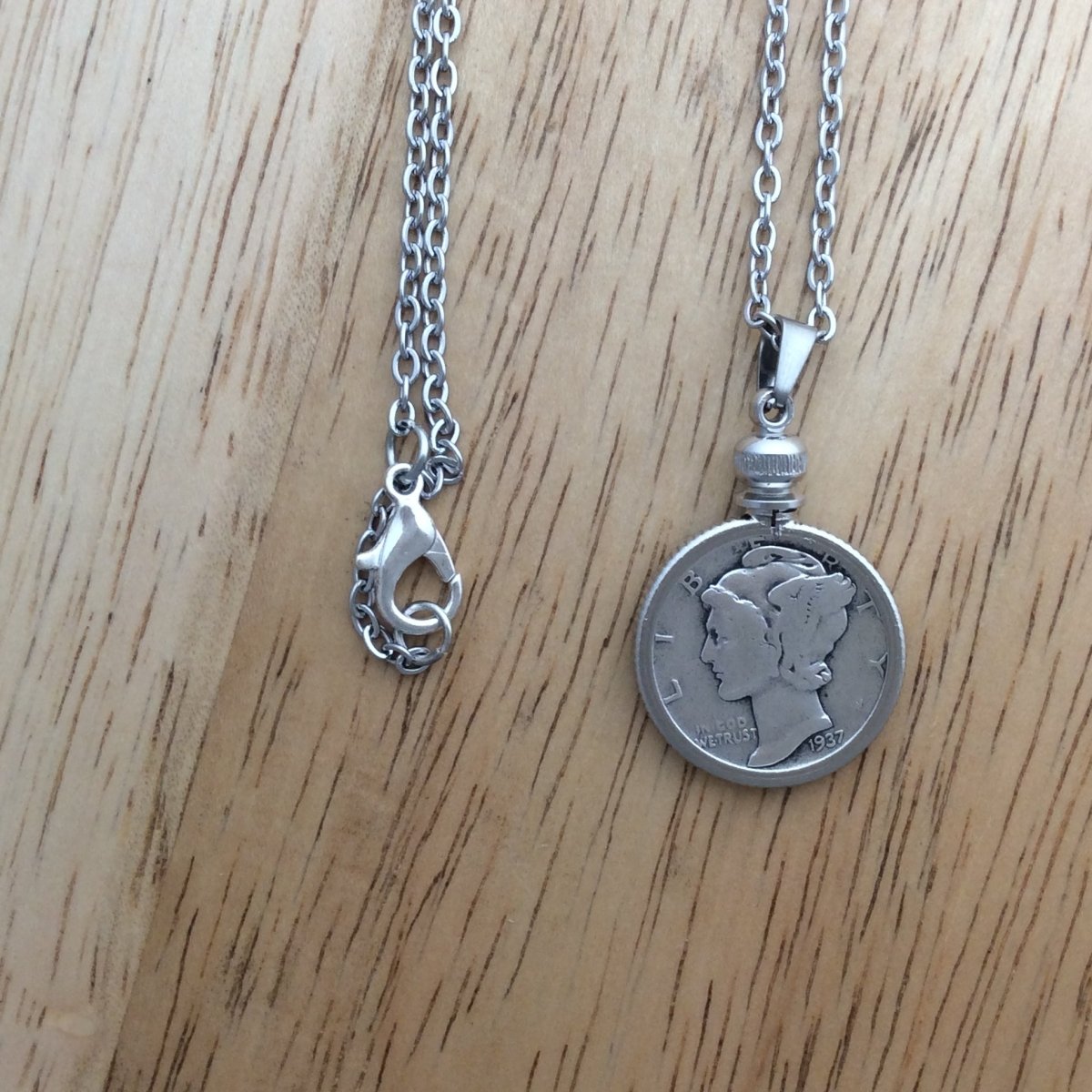 stainless steel necklace with a 1937 Mercury Dime pendant