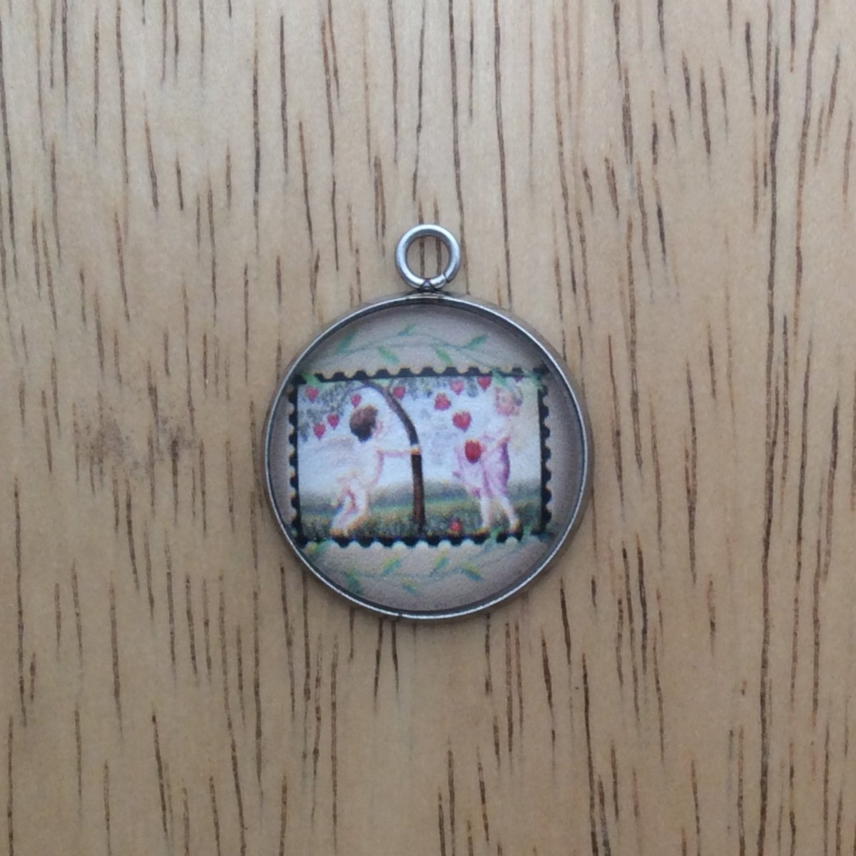  glass cabochon charm with picture of a vintage valentine stamp