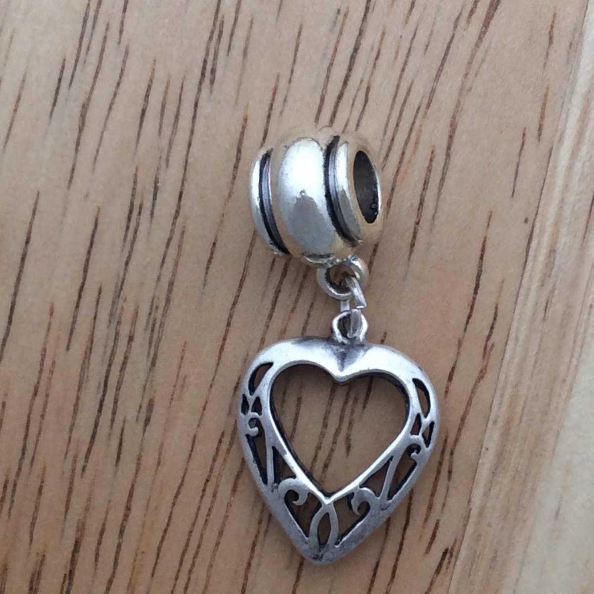 slider bead with a filagree designed heart charm