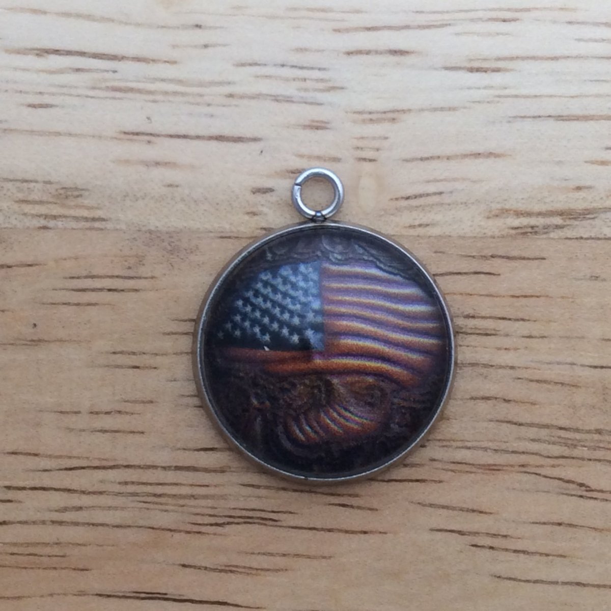 glass cabochon charm with an American flag