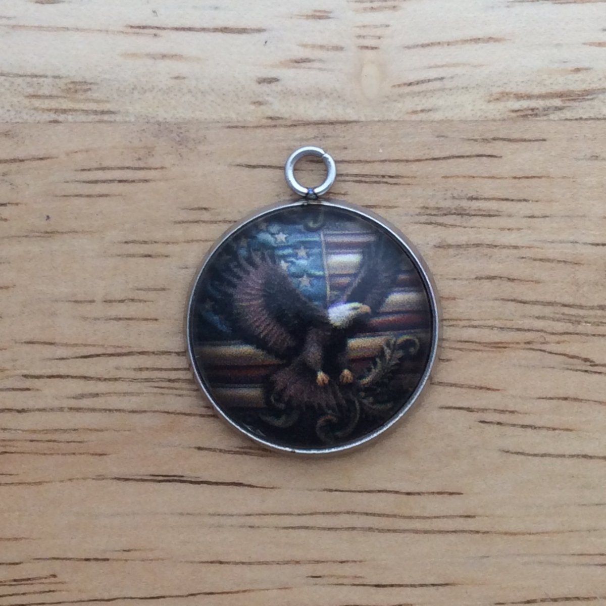 glass cabochon charm with eagle in front of American flag