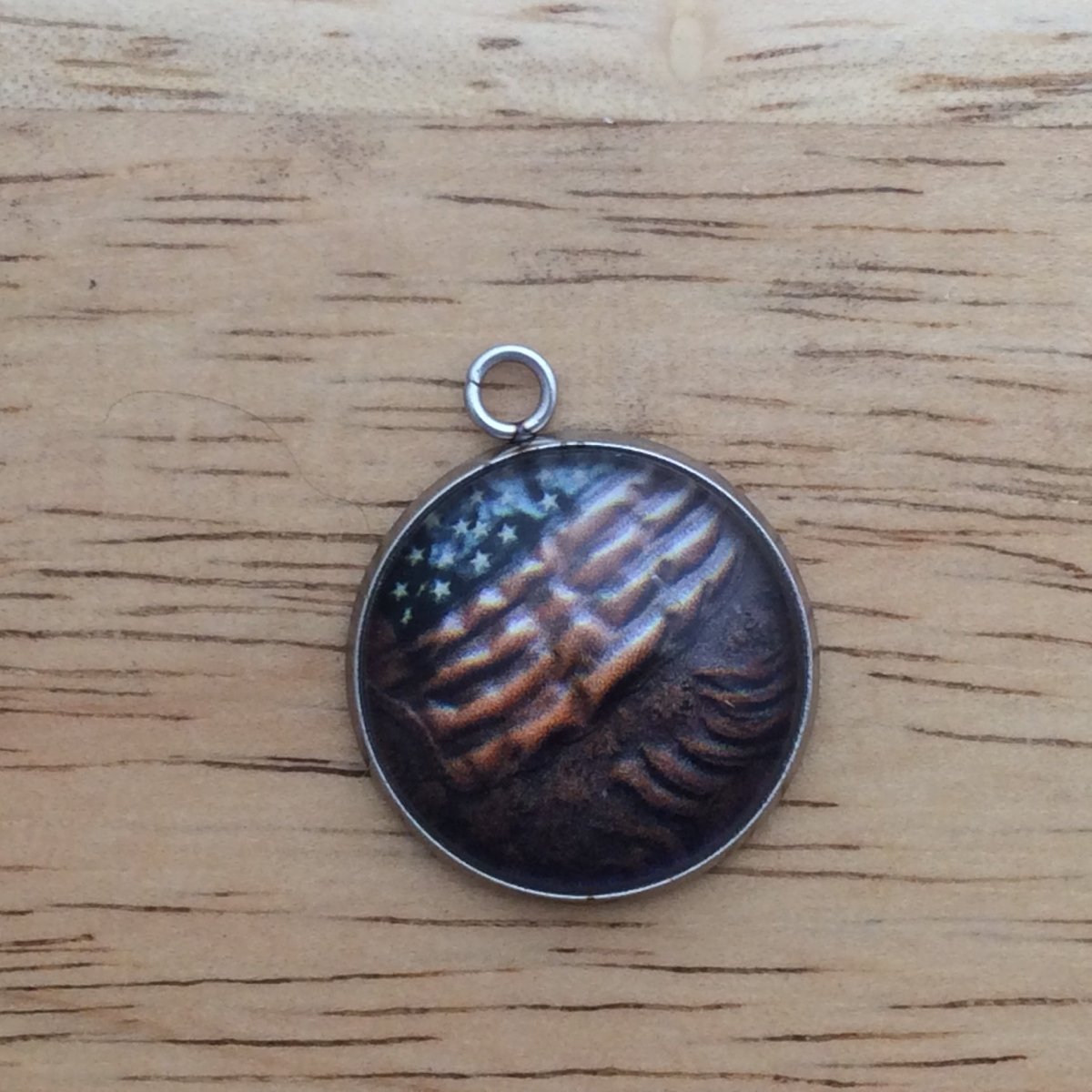 glass cabochon charm with an American flag