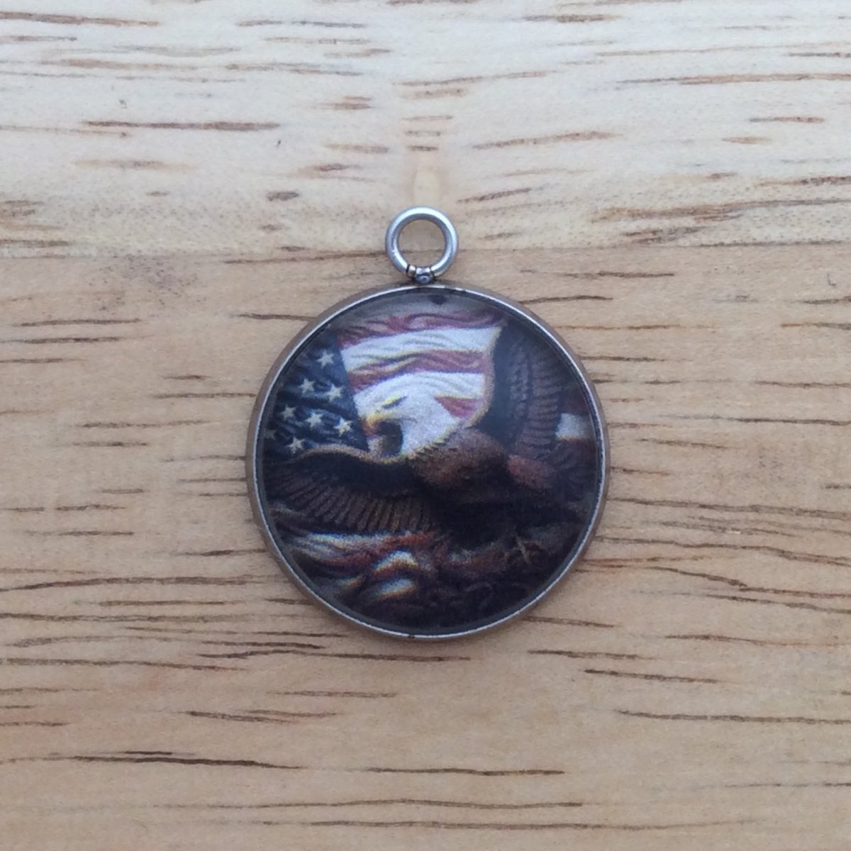 glass cabochon charm with eagle in front of American flag