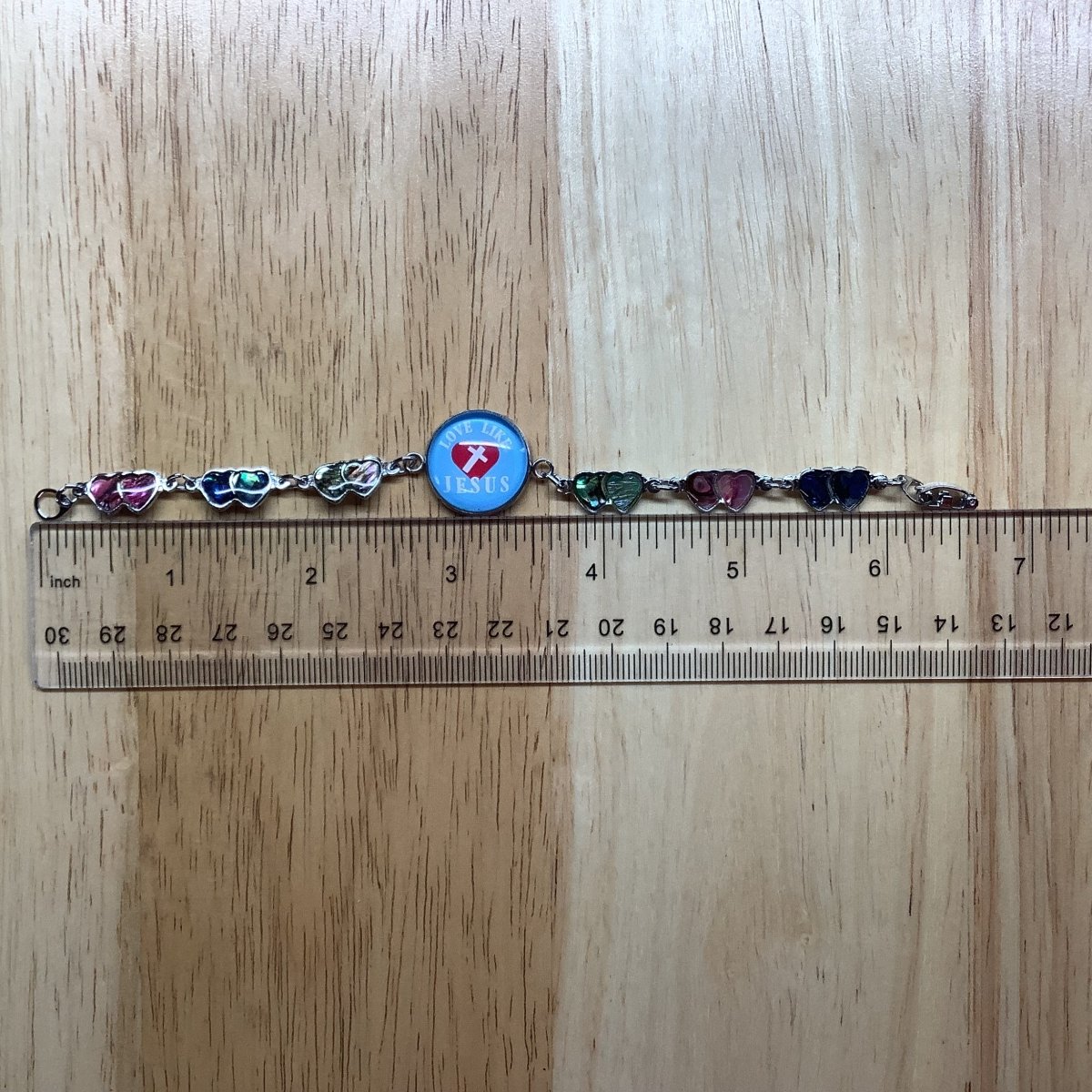 bracelet next to a ruler showing it measures 6 5/8 inches