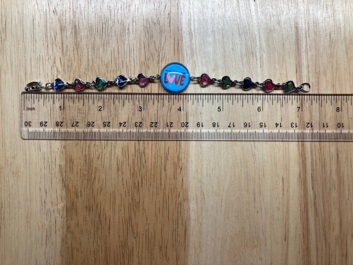 bracelet next to a ruler showing that the bracelet is 7.25 inches long