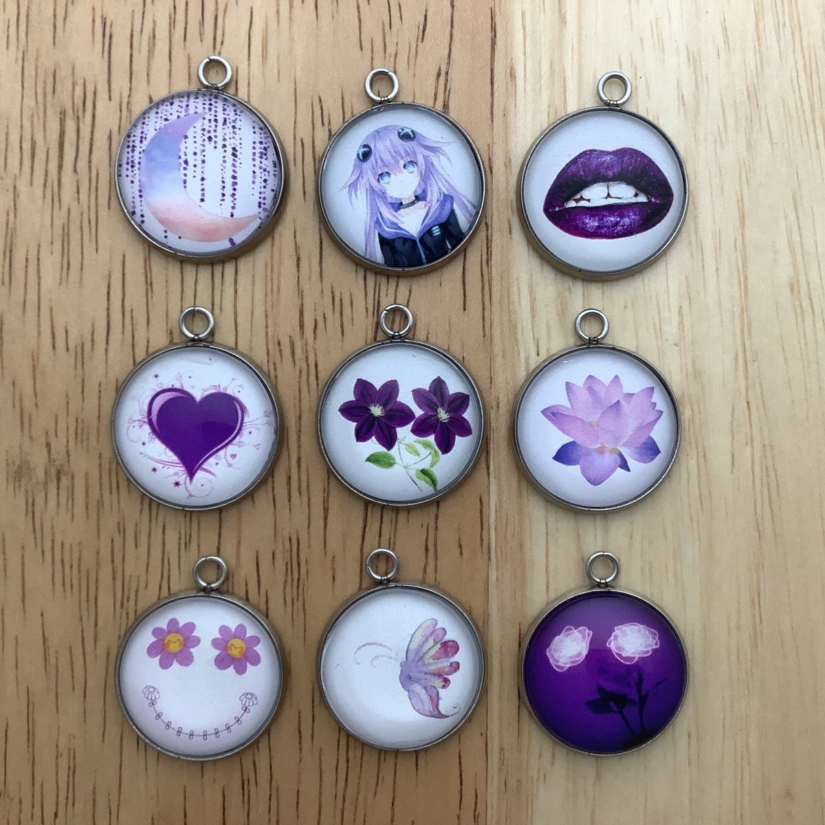 Group of 9 purple themed charms