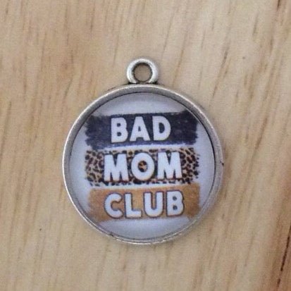 glass cabochon charm that says bad mom club