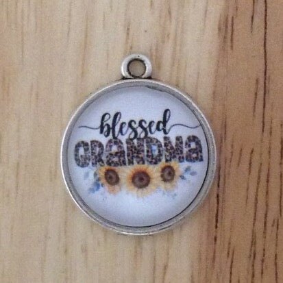 glass cabochon charm says blessed grandma with three sunflowers