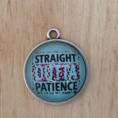 glass cabochon charm that says Straight outta patience with a teal background