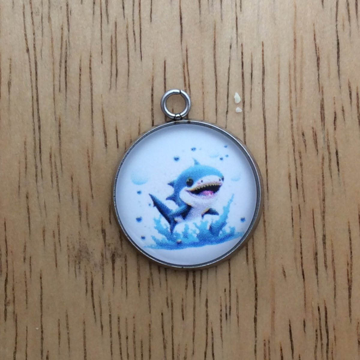 glass cabochon charm with a picture of a shark