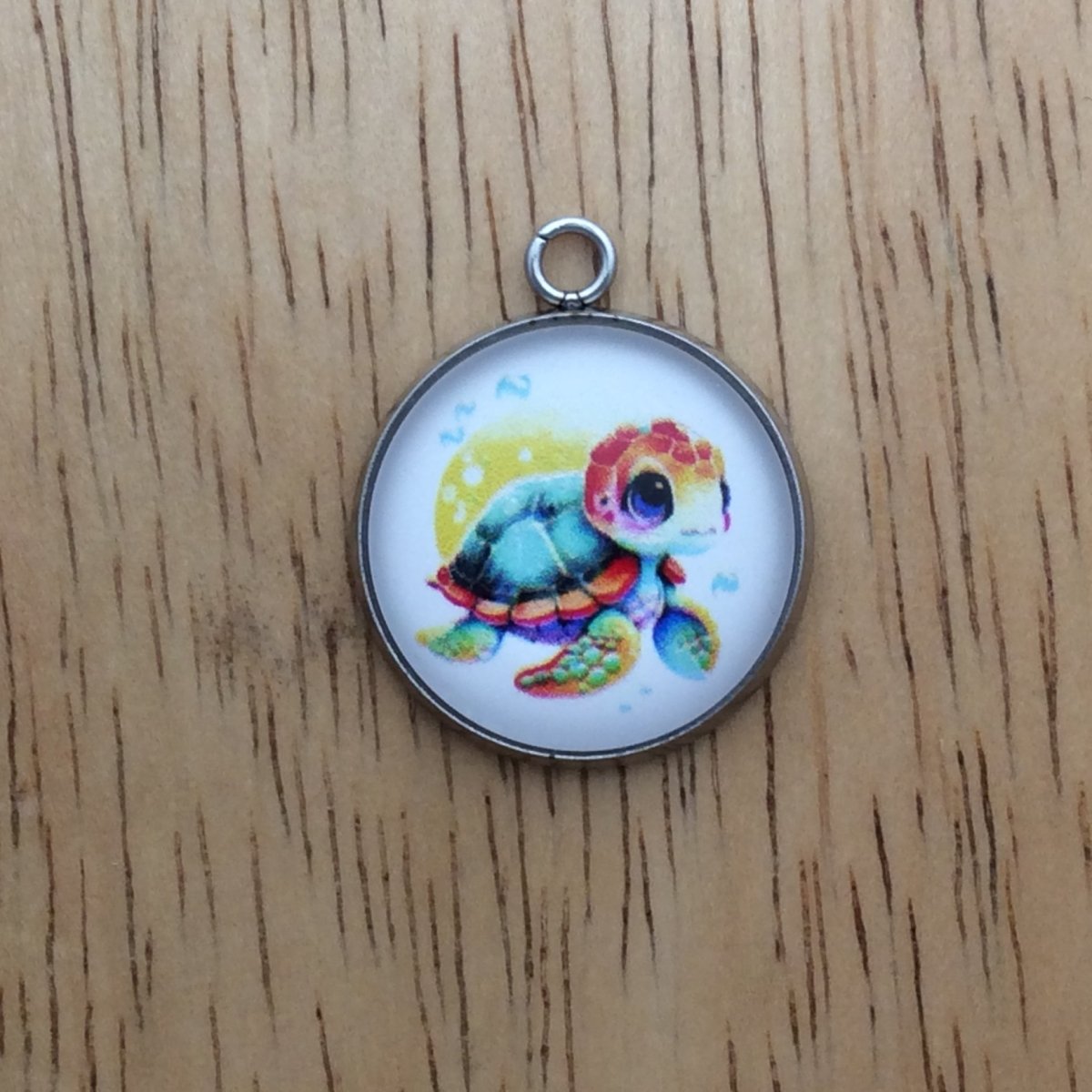 glass cabochon charm with a picture of a sea turtle