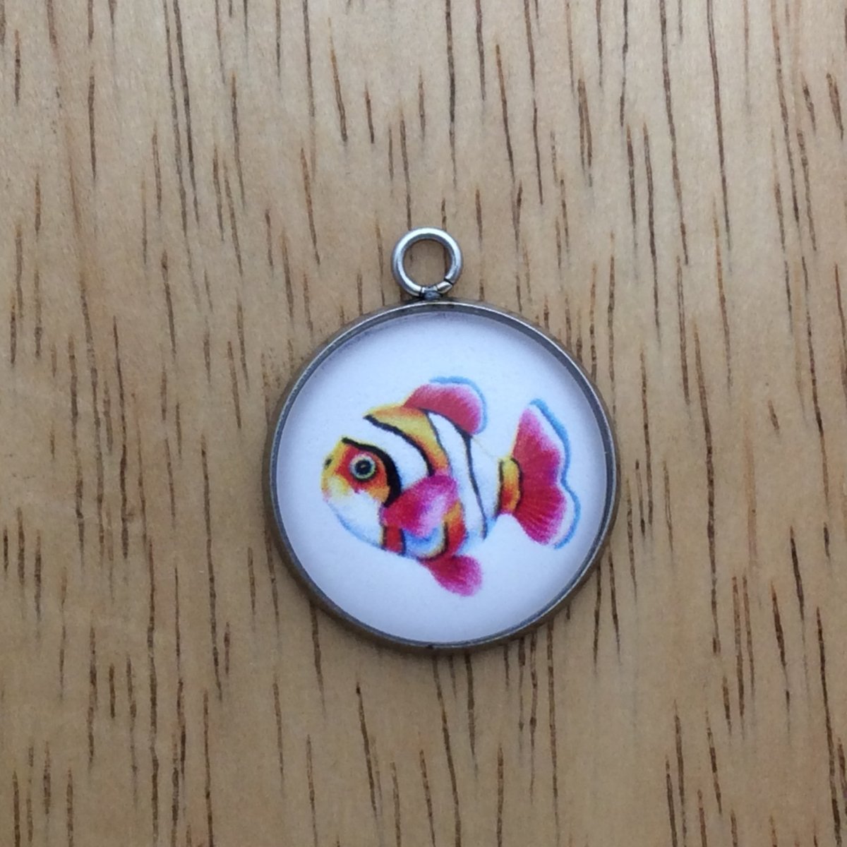 glass cabochon charm with a picture of a clown fish