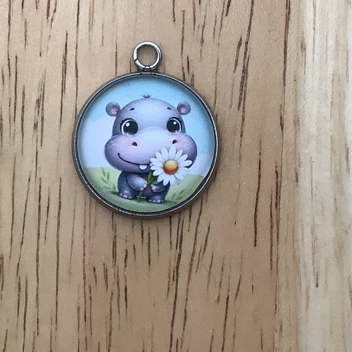 a hippo holding a daisy