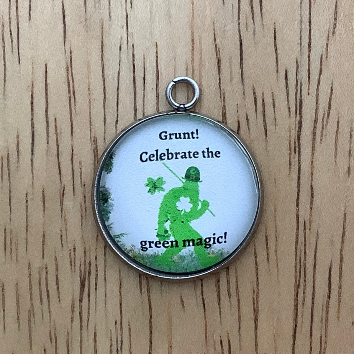 Bigfoot in green with the words 'grunt, celebrate the green magic'