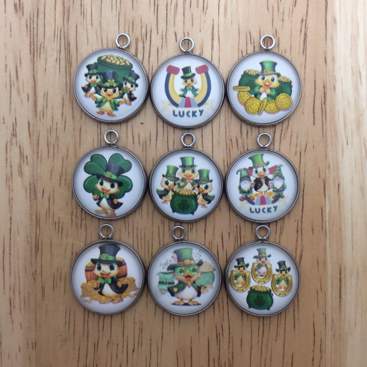 9 glass cabochon charms with Baby ducks and a st Patricks theme