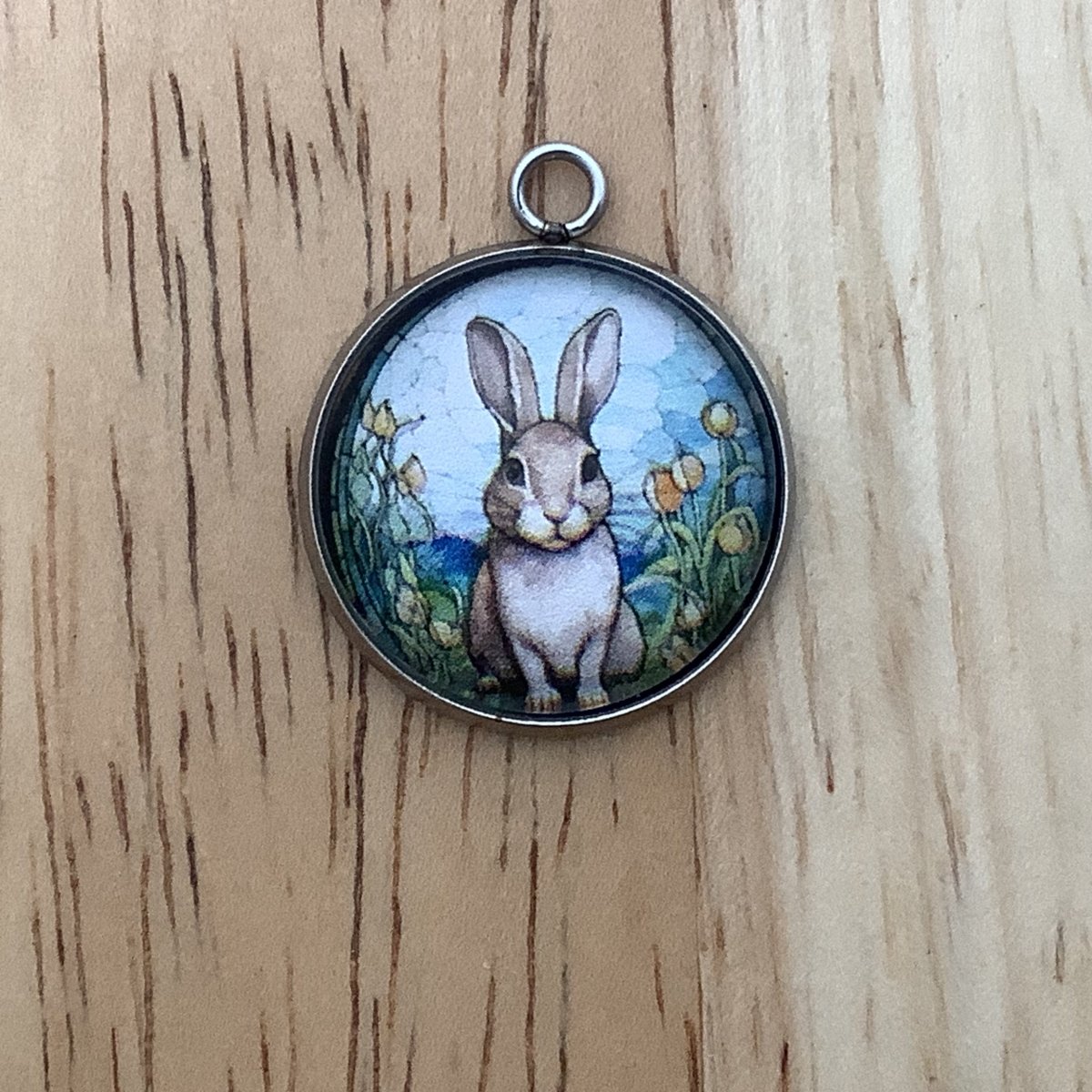 light brown bunny in a field of flowers