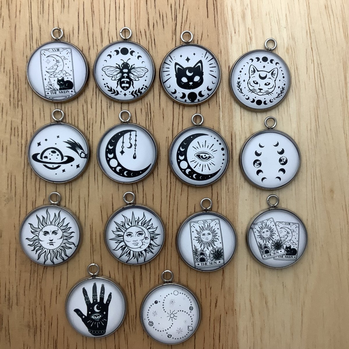 set of 14 charms featuring tarot cards and celestial designs