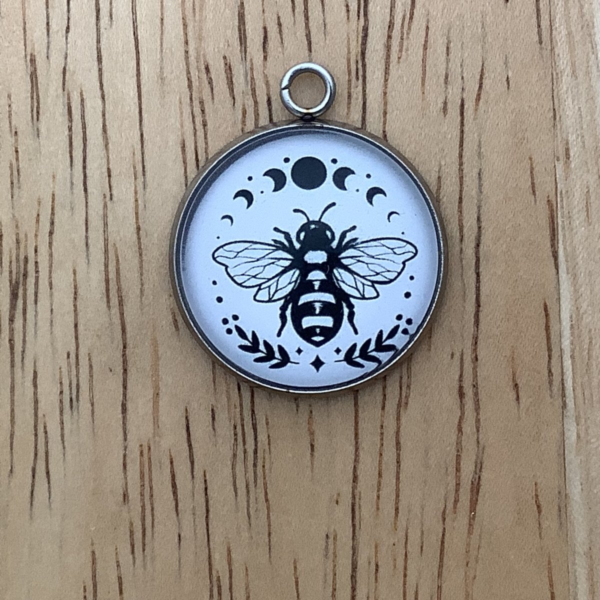 moon phases with a bee charm