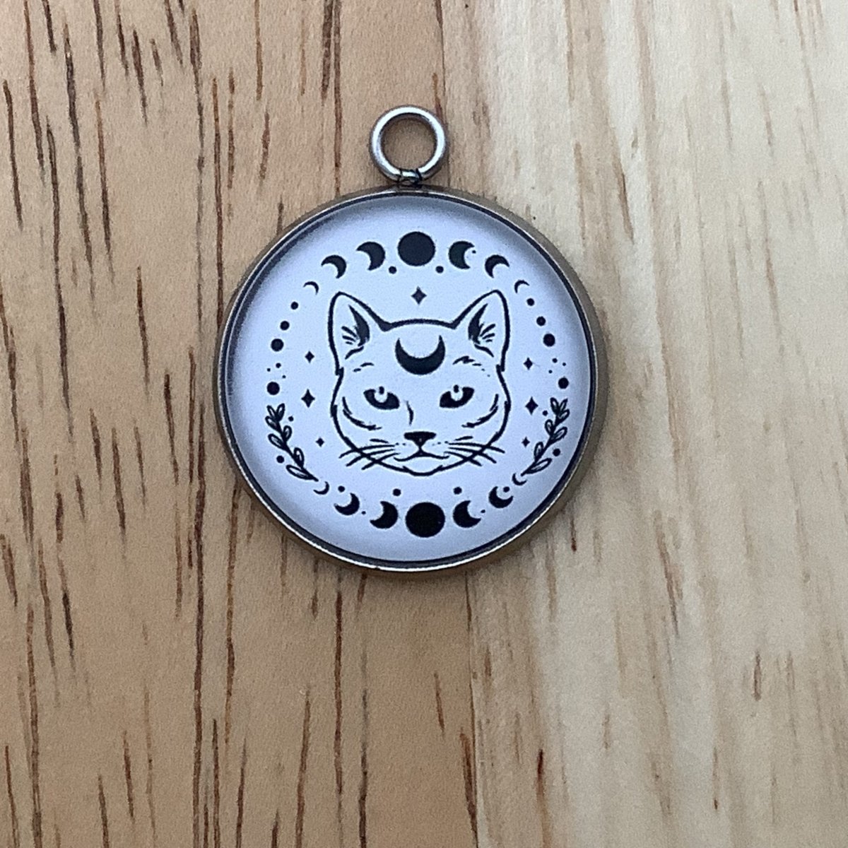 moon phases with a white cat charm