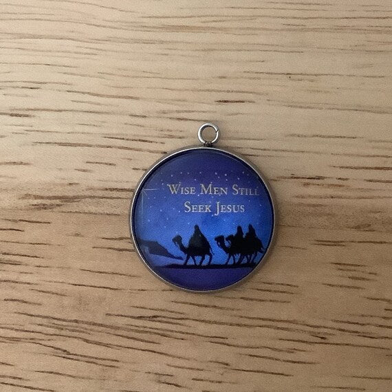 the 3 wisemen on camel back with a strry night sky with the words 'wise men still seek Jesus'