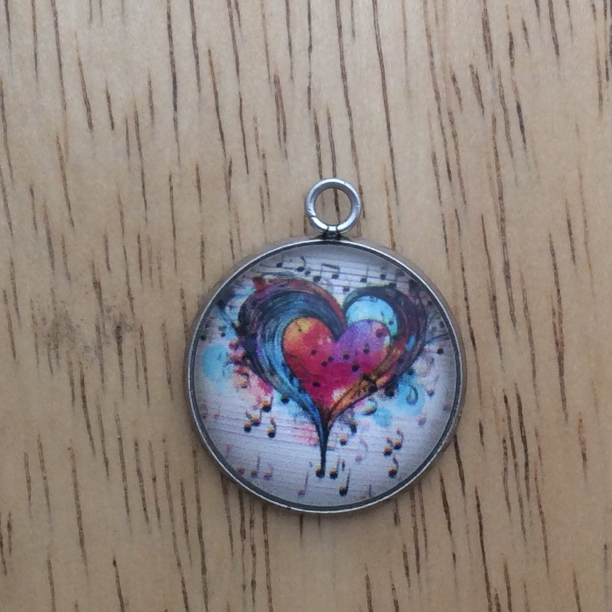 glass cabochon charm with Colorful hearts and musical notes