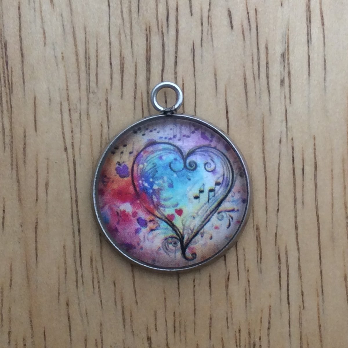 glass cabochon charm with Colorful hearts and musical notes