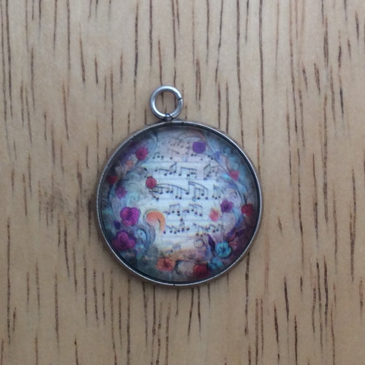 glass cabochon charm with Colorful hearts and musical notes