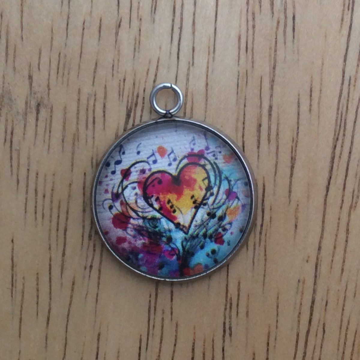 glass cabochon charm with Colorful hearts and musical notes