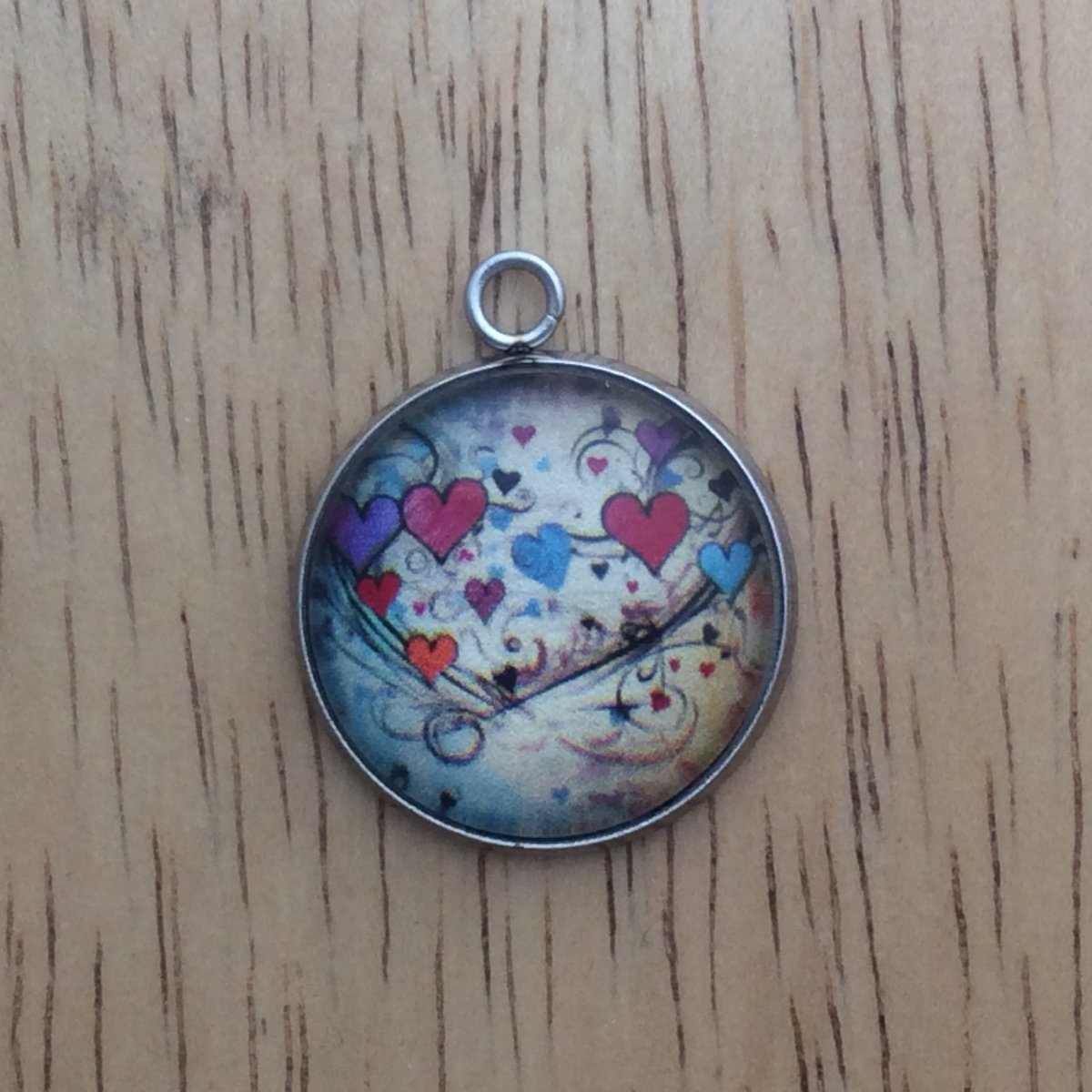 glass cabochon charm with Colorful hearts and musical notes
