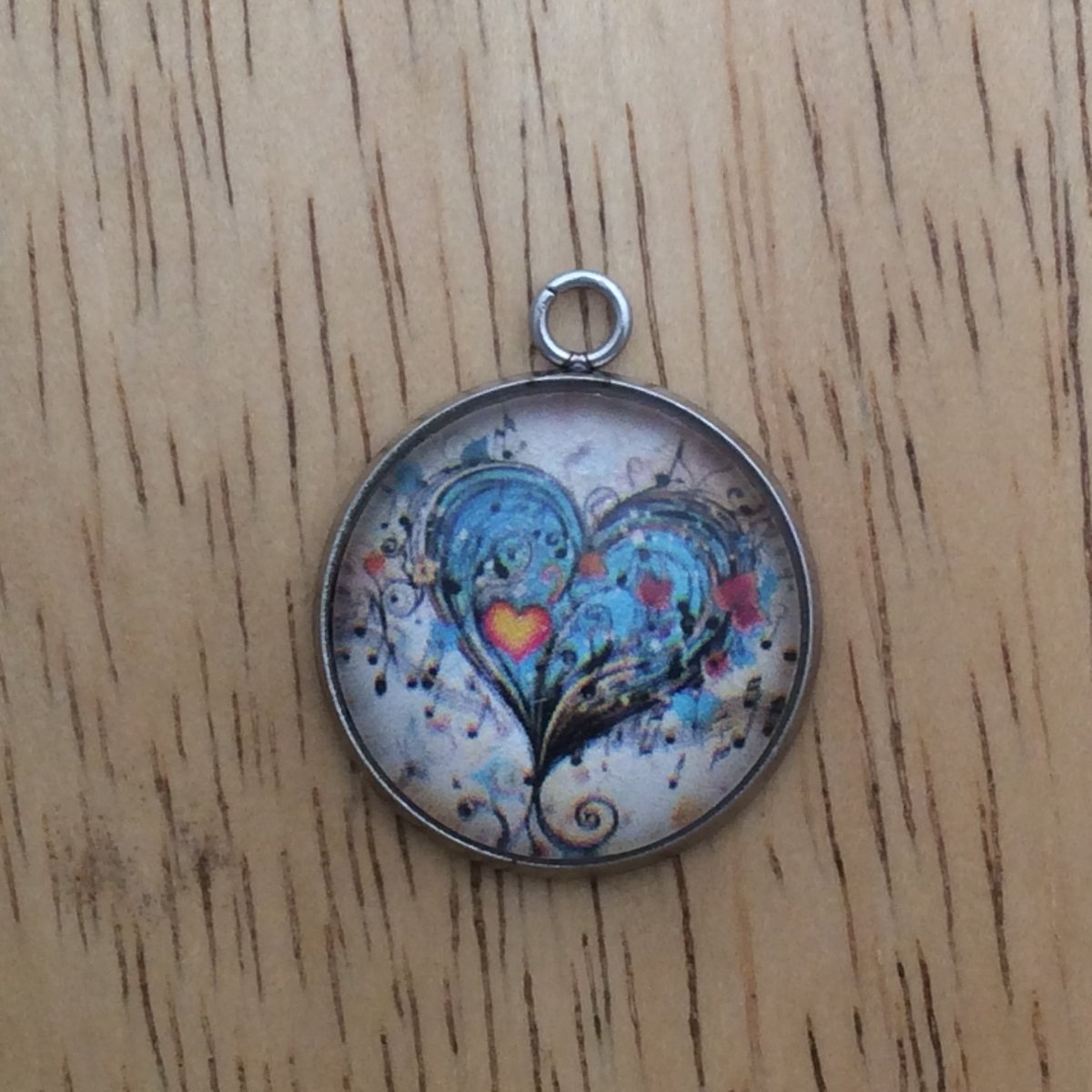 glass cabochon charm with Colorful hearts and musical notes