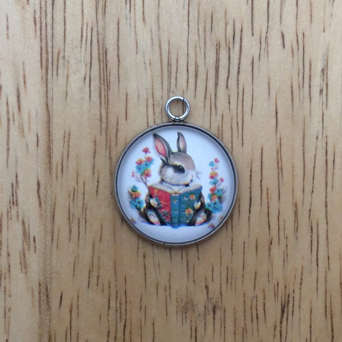 Bunny  reading a book glass cabochon charm